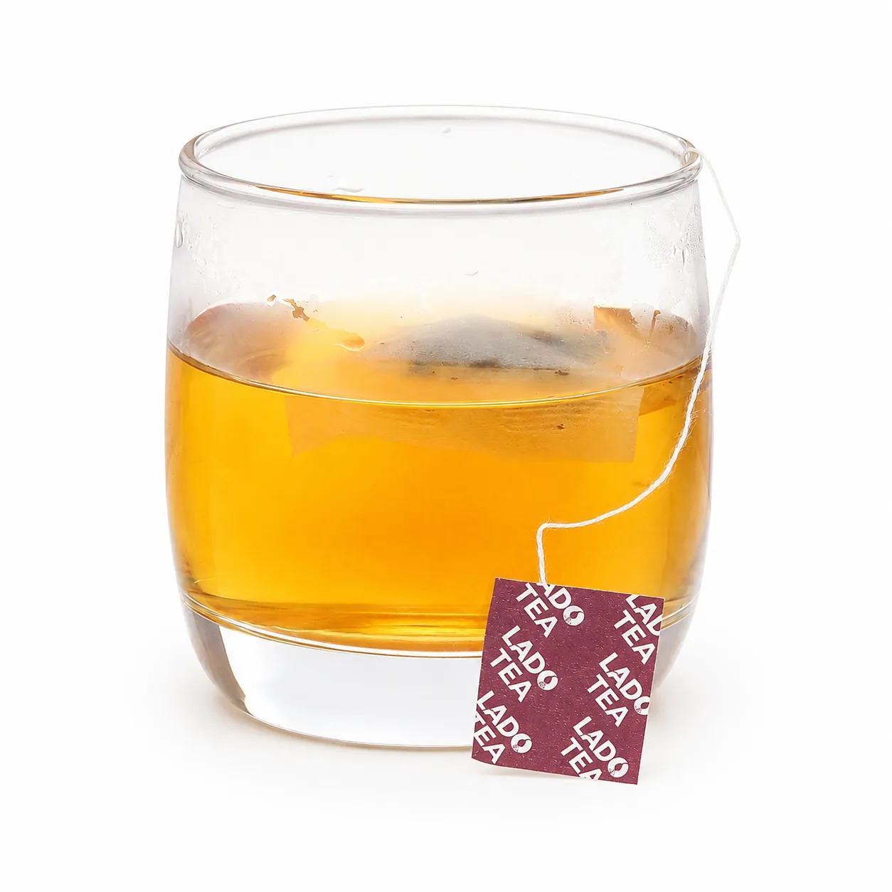 Brewed LadoActiso Artichoke Herbal Tea Brewed LadoActiso artichoke herbal tea in a glass cup with tea bag
