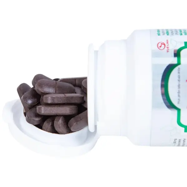 Tue Linh Gynostemma Film-Coated Tablets Tue Linh Gynostemma film-coated tablets spilling from open bottle
